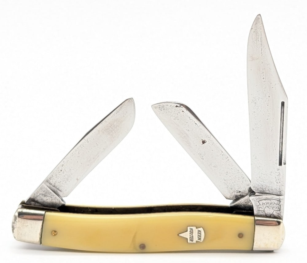 Keen Cutter Yellow Celluloid Long Pull Stockman: Knife is in nice condition with light scratches and tarnishing on the blades, light scuffs on the bolsters, and nice handle scales. Overall measures 3-7/8in when closed.