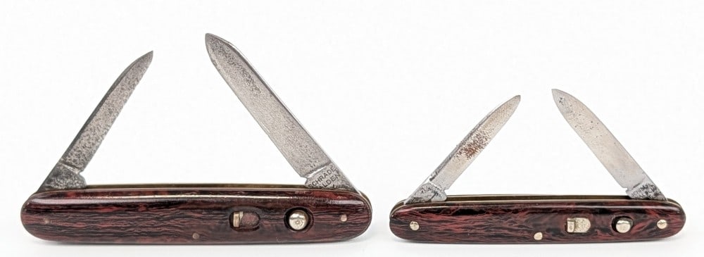 Schrade Walden Synth Marbled Brown Double Switchblade Knives: Knives are in good used condition with scratches and pits on the blades, and general wear on the handle scales. All blade springs are strong and lock tight when open. Largest overall measures 3-3/8in