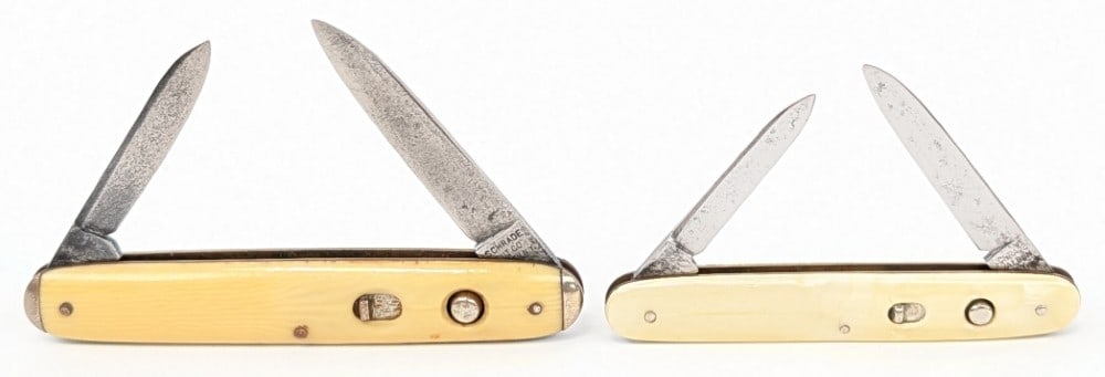 Schrade Walden Cut Co. Synth White Double Switchblade Knives: Knives are in fair aged condition with scratches and pits on the blades, and general scuffs and wear on the handle scales. Blade springs are all strong and lock tight when open. Largest overall