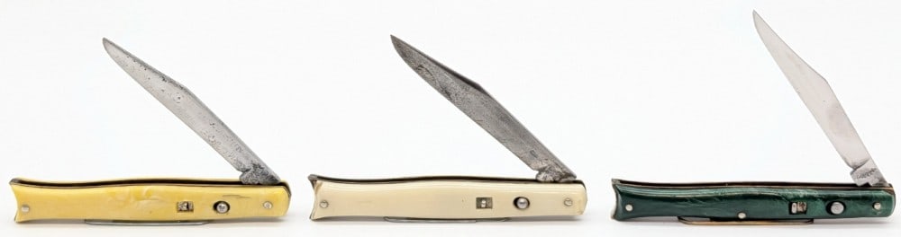 Edgemaster & Shur-Snap Colonial Synth Fishtail Switchblade Knives: Knives are in fair condition with scratches and tarnishing on the blades, and cracks and wear on the handle scales. None of the springs are very strong, and the yellow and white knife blades don't loc