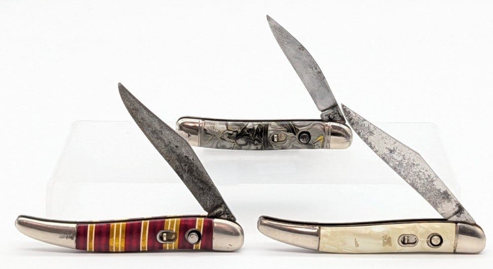 Hammer Brand Toothpick Switchblade Knives: Knives are in fair condition with scratches and tarnishing on the blades, scuffs and tarnishing on the bolsters, and general wear on the handle scales. Overall measures 4-1/4in when closed.
