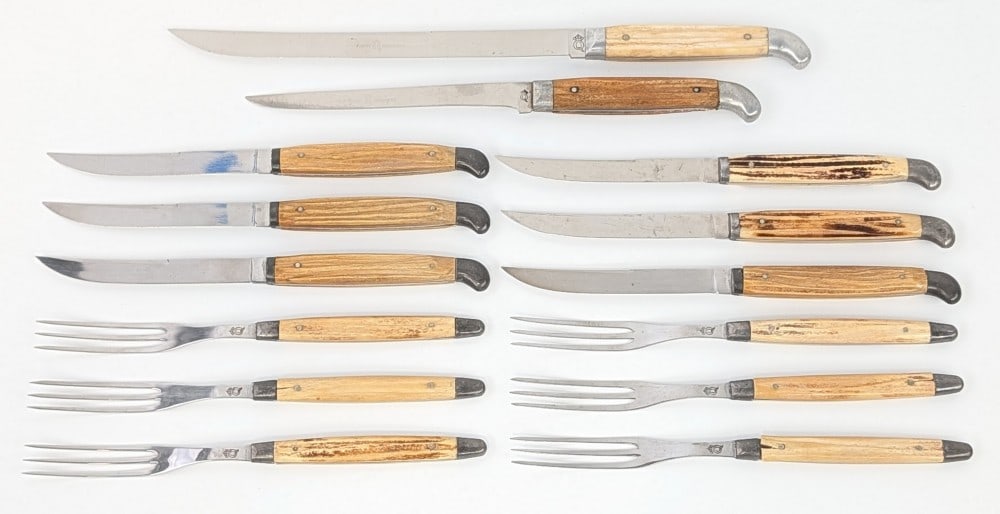 Antique Queen Cutlery Stag Steak Knife & Fork Set: Incudes (6) steak knives, (6) forks, and a 6in and a 9in carving knife. Knives are in fair condition with with some scratches and tarnishing on the blades, and some chips and cracks on the handles.?