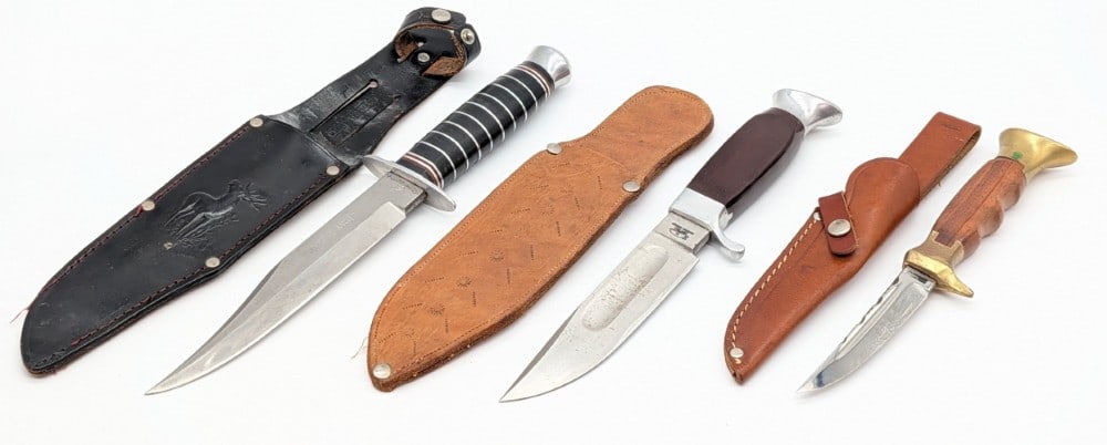 Clauwood, Olsen, & Solingen Fixed Blade Hunting Knives w/ Sheaths: Knives are in good used condition with different amounts of scratches and wear from use and handling. Largest blade length measures 6-1/8in and overall 10-1/2in.