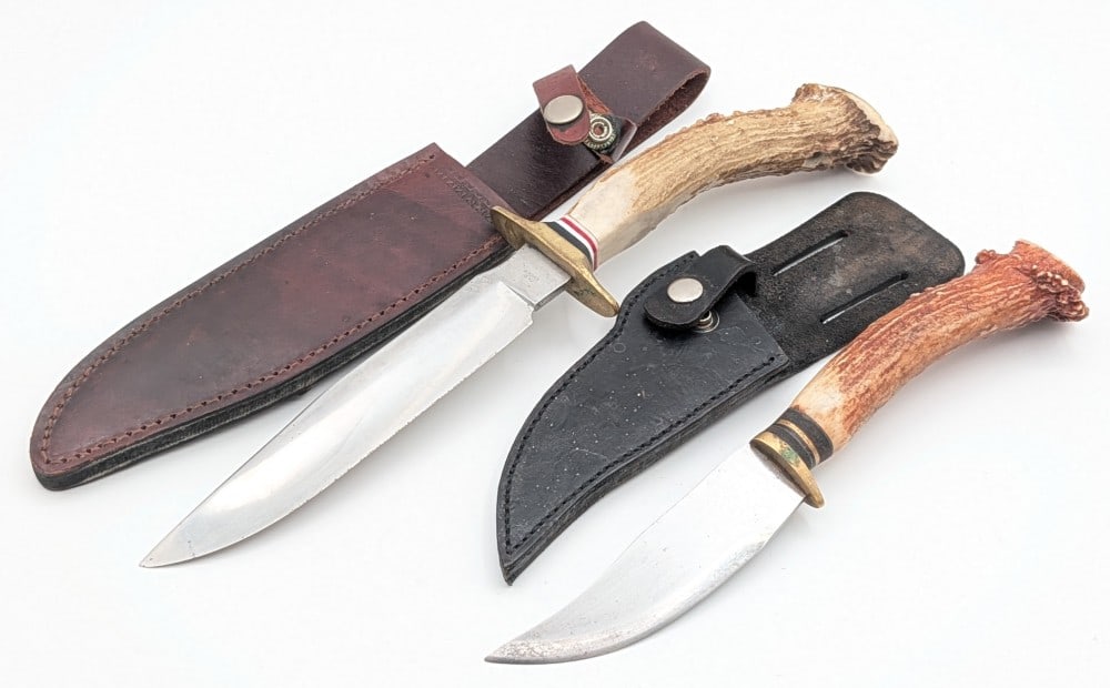 (2) Crown Stag Hunting Knives w/ Sheaths: Knives are in good condition with some scuffs on the blades, and tarnishing on the brass from age. Largest blade length measures 7in and overall 13in.