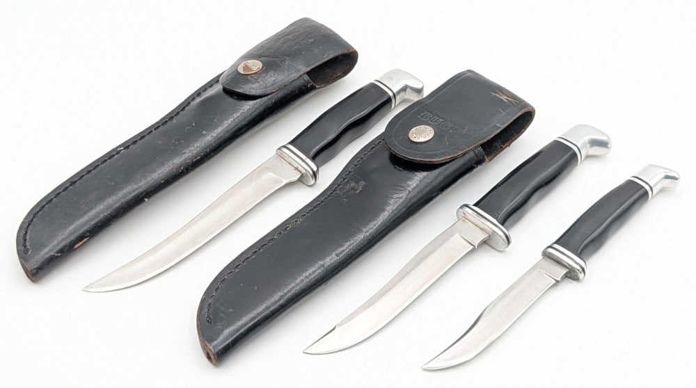Buck 121, 105, 102 Hunting Knives: Knives are in various used conditions with different amounts of scratches and wear from use and age. Largest blade length measures 5-1/2in and overall 9-3/4in.