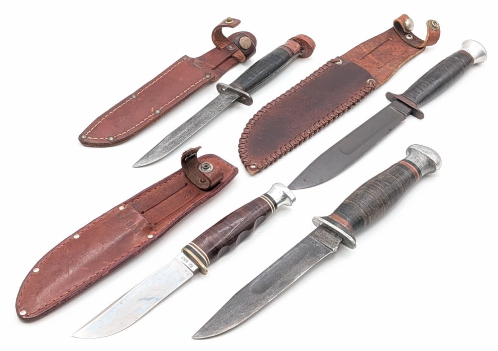 Western, Ka-Bar, Hoemberg, & Robeson Hunting Knives: Knives are in various used conditions with different amounts of scratches and wear from use and age. Largest blade length measures 5-5/8in and overall 10-3/4in.