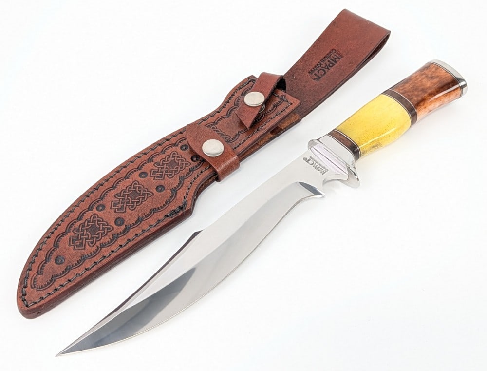 Impact Custom Knives Smooth Bone Bowie Knife w/ Sheath: Features a mirror polished bowie blade, a polished steel single guard, a smooth bone handle with stacked leather spacers, and a polished steel butt plate. Knife is in like new condition with a bit of 