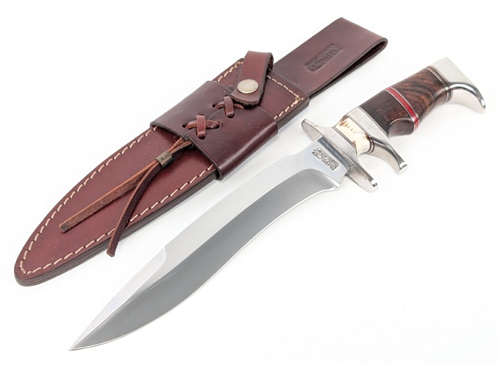 Impact Custom Knives Kukri Blade Sub Hilt Fighter w/ Sheath: Features a satin finish kukri blade, a polished steel double guard with a sub hilt, a smooth wood handle with a stag spacer, and a polished steel crows beak pommel. Knife is in nice condition with som