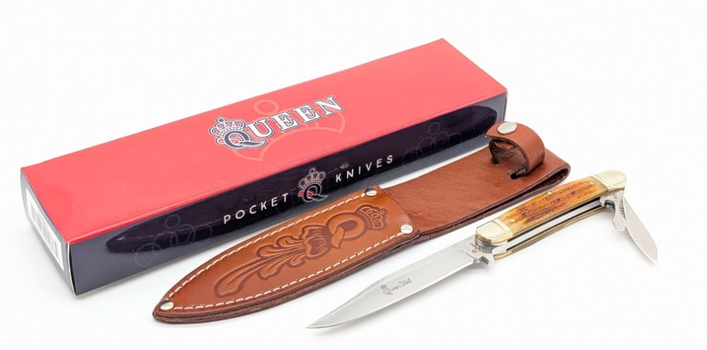 NIB Queen Cutlery Jigged Bone Fixed Blade / Folding Knife: Knife is in new condition. Overall measures 8-1/2in.