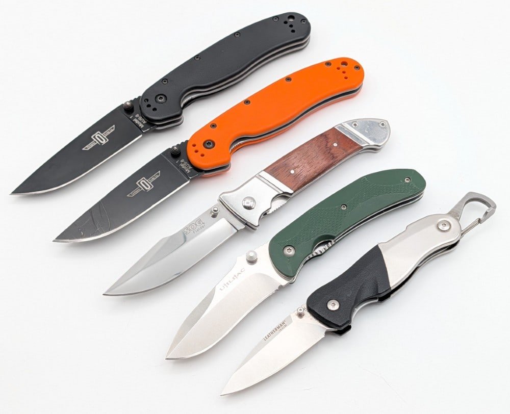 (5) Various Brand Modern Folding Knives: Brands include Ontario Knife Co., Leatherman, Utiliac, & SOG. Knives are in good condition with some scratches from use. Largest overall measures 5in when closed.