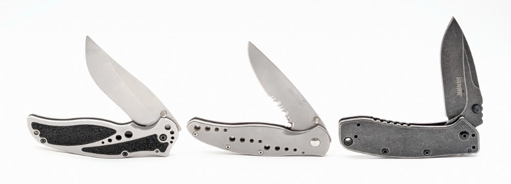 (3) Kershaw Flipper Folding Knives: Knives are in good used condition with various scuffs and scratches from use and handling. Largest overall measures 4-3/4in when closed.