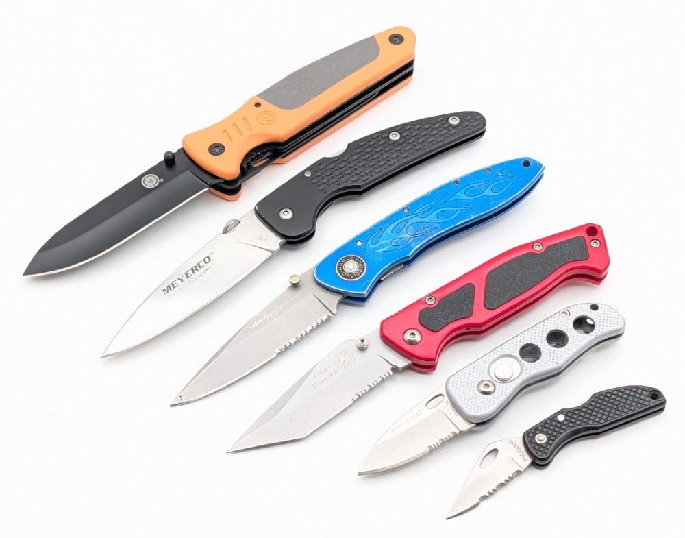 (6) Various Brand Modern Folding Knives: Brands include Harley, Blackie Collins, UST, Sharp Eagle, & more. Knives are in good used condition with scuffs and scratches from use and handling. Largest overall measures 5-3/8in when closed.