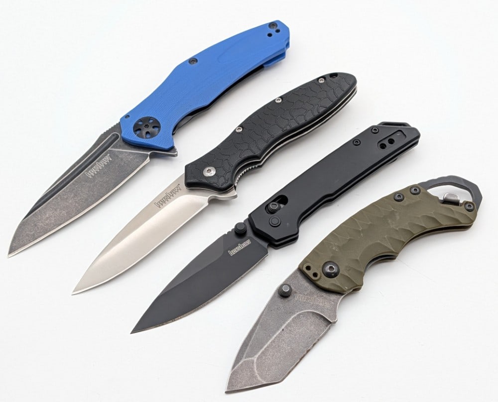 (4) Kershaw Flipper Folding Knives: Knives are in nice condition with light scuffs and wear from handling. Largest overall measures 4-1/4in when closed.