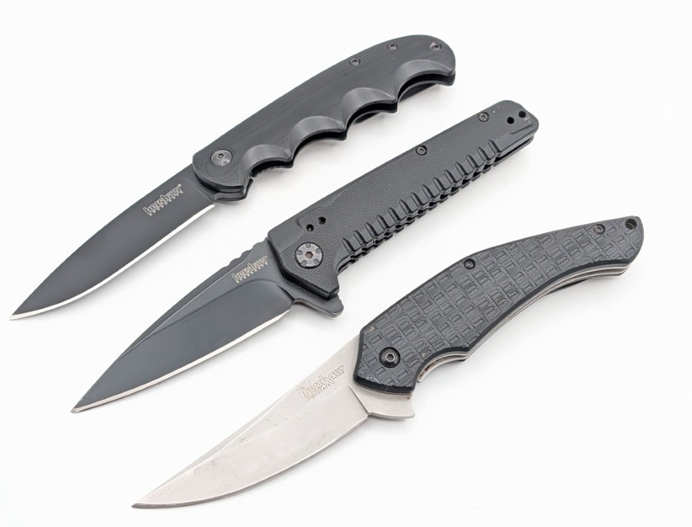 (3) Kershaw Spring Assisted Flipper Folding Knives: Knives are in nice condition with light scuffs on the blade and handles from use and handling. Largest overall measures 4-5/8in when closed.