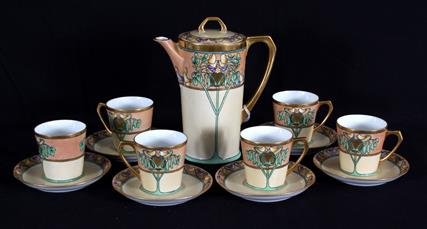 Art Nouveaux Hand-Painted Chocolate Pot Set: Art Nouveaux Hand-Painted Porcelain Chocolate Pot Set. Teapot and six cups and sauces. Signed "Clover" on bottom. Teapot measures 8"H. Condition: no major condition issues.