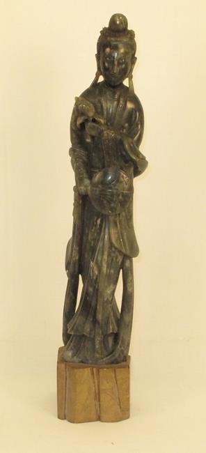 Chinese Carved Guanyin Soapstone Figure: Chinese Carved Guanyin Soapstone Figure: Chinese Carved Guanyin Soapstone Figure on base. Size: 14" T. Condition: a few light nicks and scuffs.