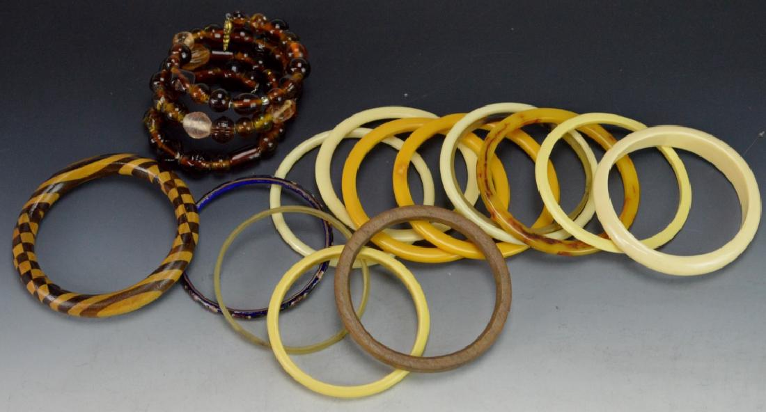 Bakelite Jewelry Bracelets Grouping: Includes vintage Bakelite,faux Bakelite, and faux ivory bracelets. (15) Bracelets of varying materials beaded, wood, enamel etc.