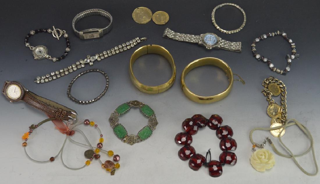 Sterling Bracelet Jewelry Wrist Watch Grouping: Includes (10) Bracelets beaded, (1) is carved green glass with birds in relief and sterling silver filagree, others to include metals, bejeweled etc (4) wrist watches Perini, Vanity Fair, Genesis and 