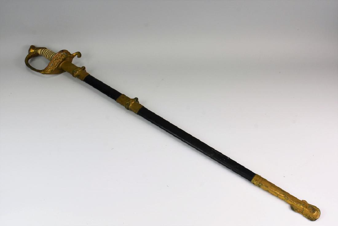 USN Navy Sword: This beautiful sword is marked Bottom of blade marked "PROVED" inside a ricasso six point star, and on the reverse side, "AMERICAN MILITARY SUPPLY CO Germany." With scrollwork and naval decorations th