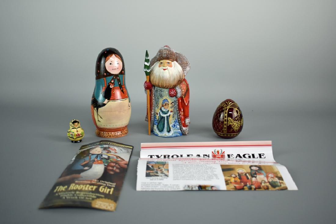 Russian Nesting Doll Grouping: Includes: (4) pieces: (2) Matryoshka Nesting Dolls, one with 8 pieces and the other with 5, with original paperwork and each is artfully and beautifully decorated, a christmas carving of Saint Nick si