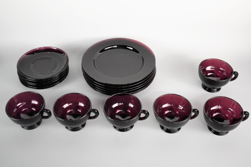 Amethyst Glass Tea Service: Incldues: (18) pieces in total including, :(6) tea cups, (6) saucers measuring: 5.75", and (6) plates measuring: 8.25