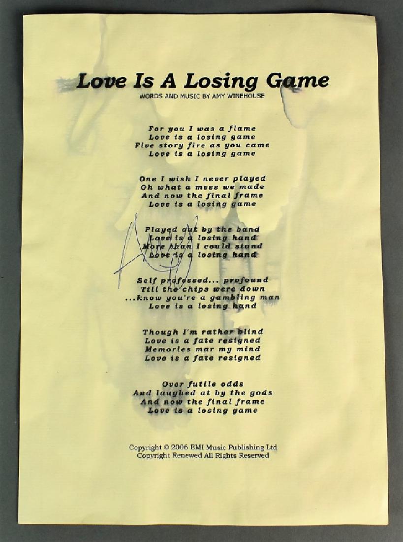 Amy Winehouse Autographed Lyrics Sheet: An Autographed Lyrics Sheet of song, "Love is a Losing Game," words and music by Amy Winehouse, 2006. Has water damage. Signed in center.