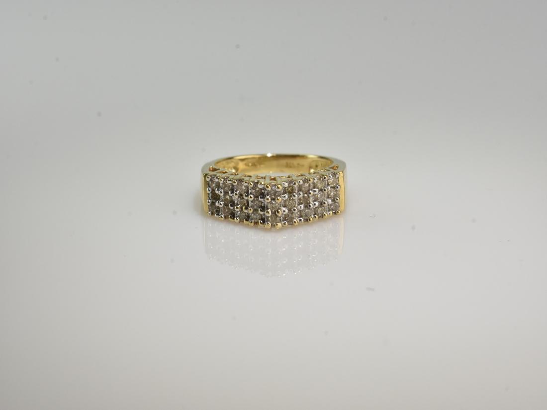10 kt. Gold and Diamond Ring: 10 k Gold Ring with 27 single cut diamonds. Approx. weight 0.25 ct with diamonds. Ring size 4 1/2.