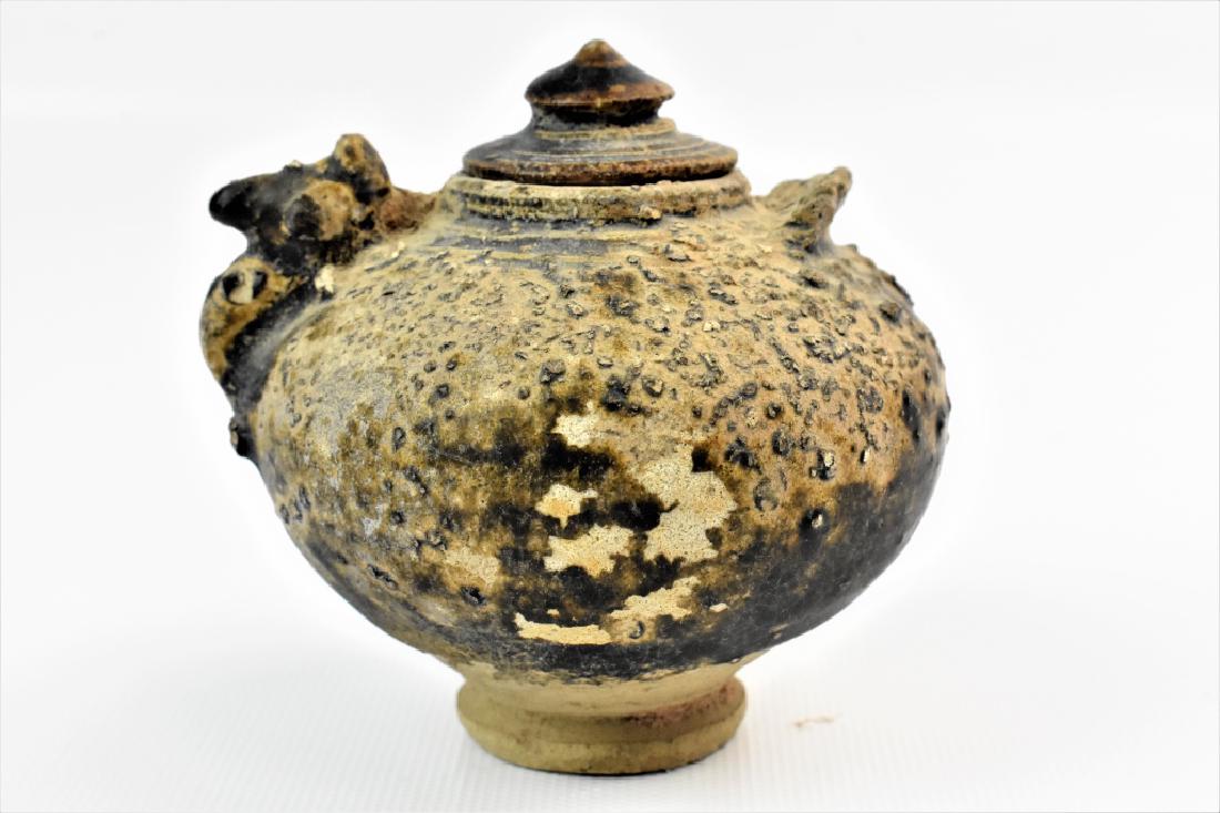 Excavated Ch'Ang-sha Stoneware 6 Dynasties: Lot includes pottery vessel retaining the original Yueh type glaze. Measures 3.25" high by 3.5" wide.