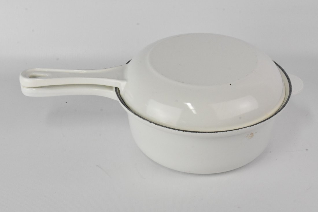 Le Creuset #22 2-IN-1 Saucepan: A Blue Enamel Le Creuset #22 2-IN-1 Saucepan and Skillet Lid. Saucepan is 2.5 Quart and Skillet is approx. 8"