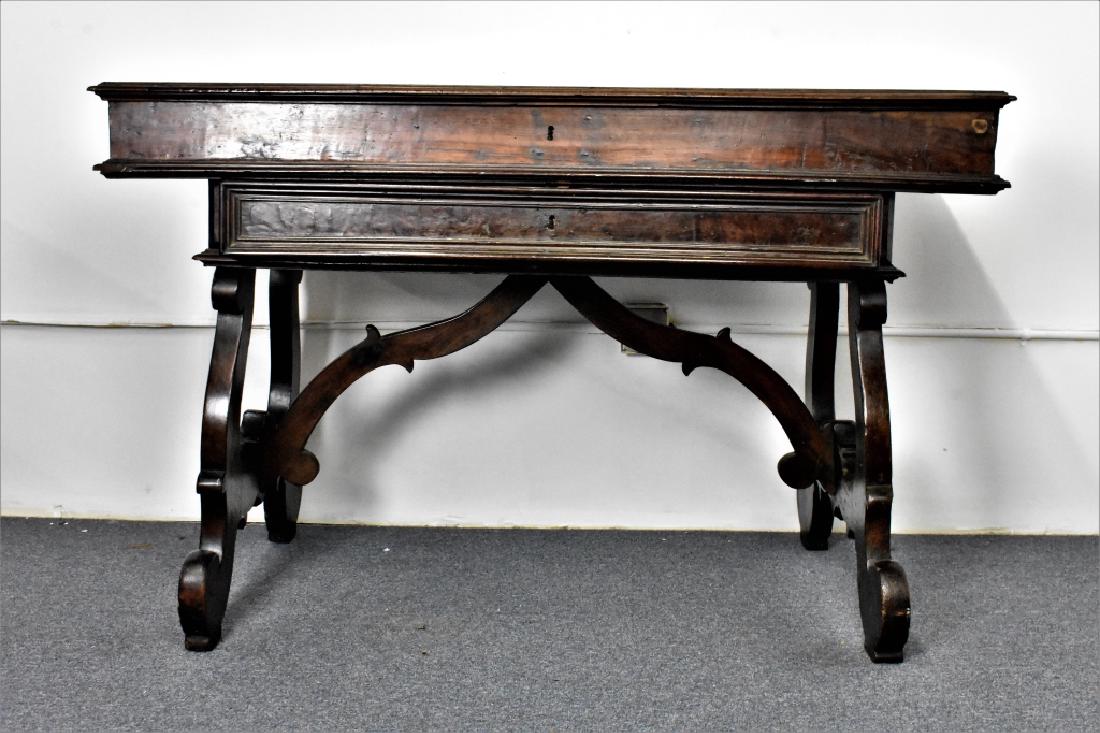 Italian Renaissance Writing Table: Italian Renaissance writing table circa early 1800's measuring: 57"L x 37"H x 28"W. Solid walnut construction, top is locked contents and condition unknown provenance from the living estate of John Cl
