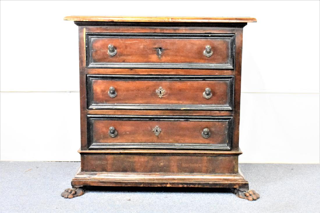 Italian Renaissance Dresser: An Italian Renaissance Dresser with (3) drawers resting on carved claw feet. All knobs are cast bronze pulls; one key escutcheon short. Original varnish shaped top with carved edge with some loss to e