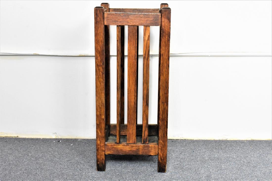 Mission Oak Stickley Style Umbrella Stand: An Arts and Crafts or Mission Style Umbrella Stand retaining its original varnish with hand hammered copper basin. Measures approx. 28"h by 12"l by 12"w