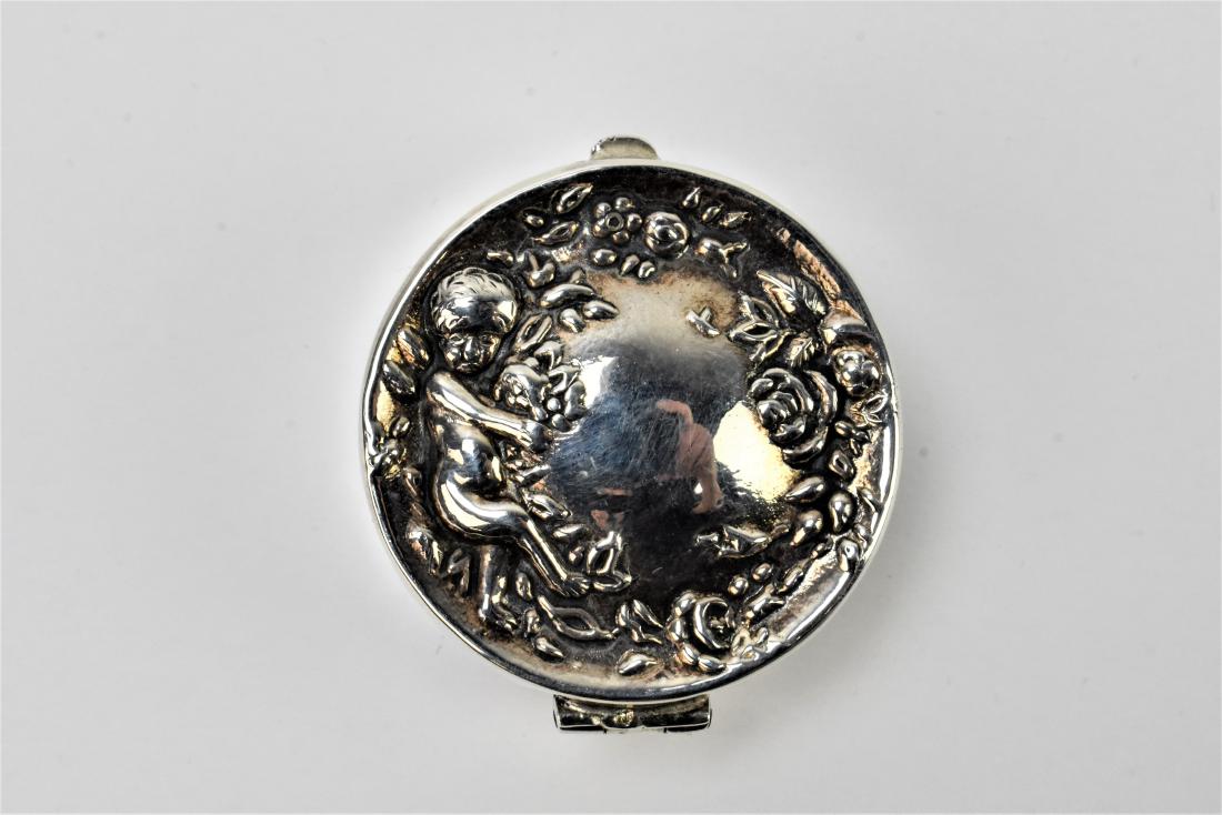Antique Victorian Sterling pillbox with Angel: An Antique Victorian Sterling Locket with Angel.