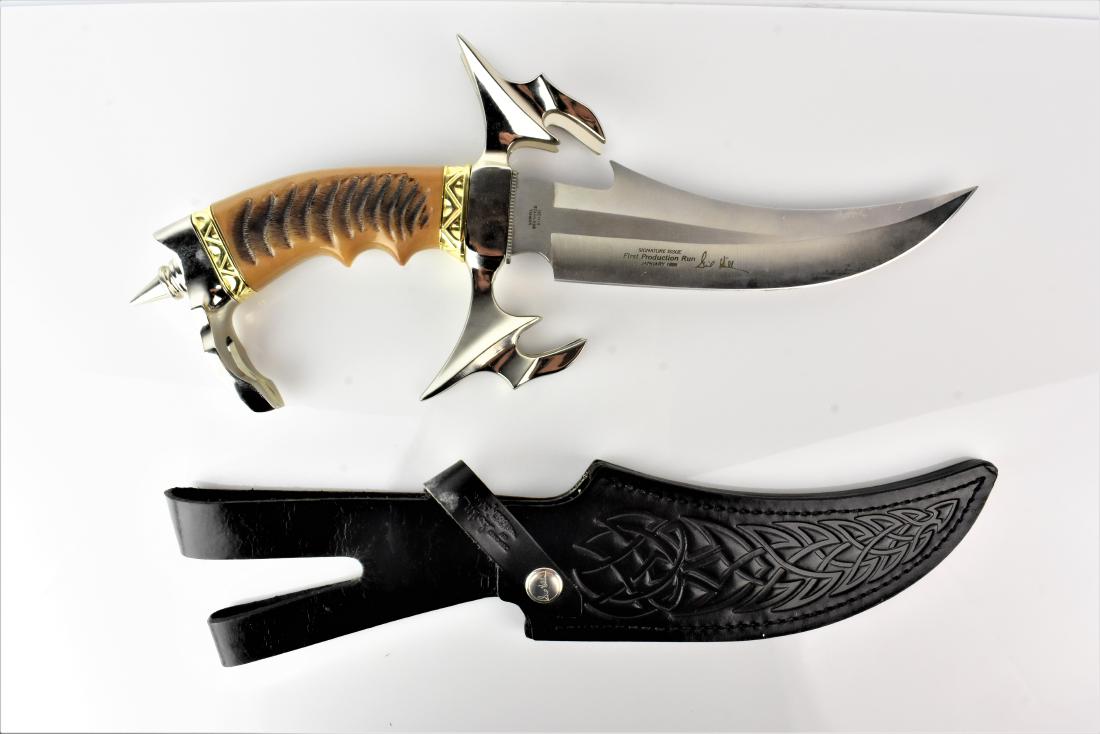 United Fantasy Dagger: Blade is marked United UC1229. Stainless Taiwan. Design 2000 UCC. Handle stylized as an Eagle. Knife rests in a dark wood stand. Blade is VERY SHARP.