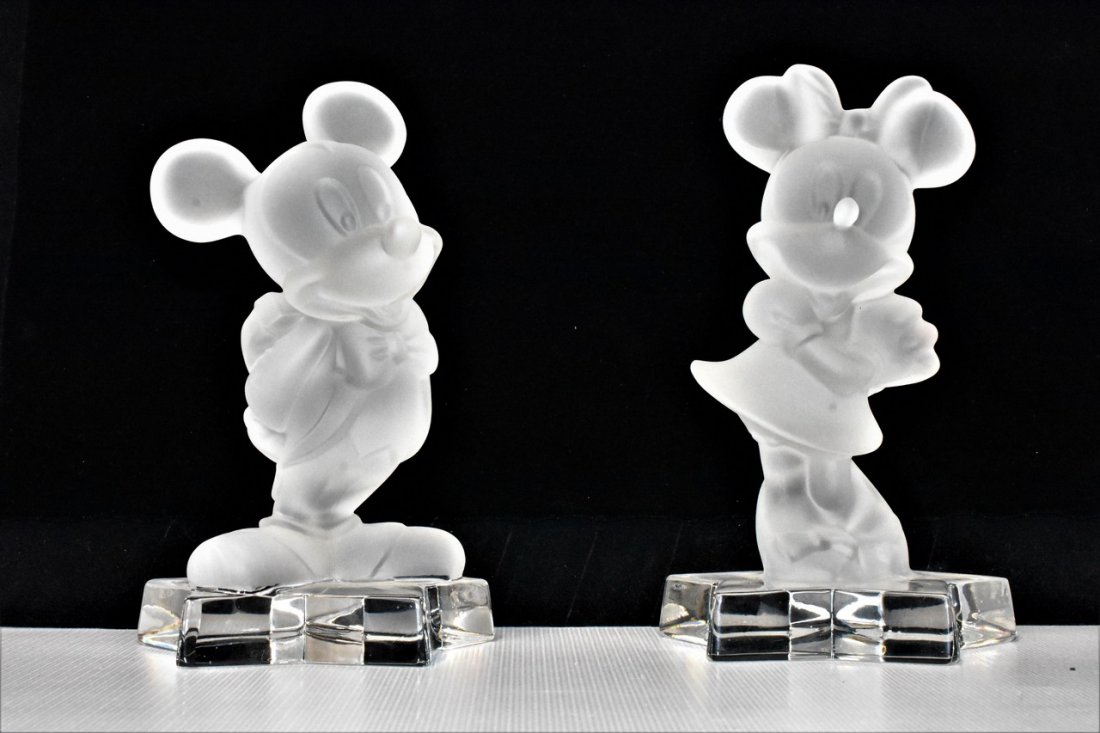Goebbel Lead Crystal Mickey and Minnie Figurines: A Pair of Goebbel Frosted Lead Crystal Mickey and Minnie Figurines. Star bases are clear. Acid etched on base: Goebel Germany, Disney. Each figurine measures approx. 6"h.