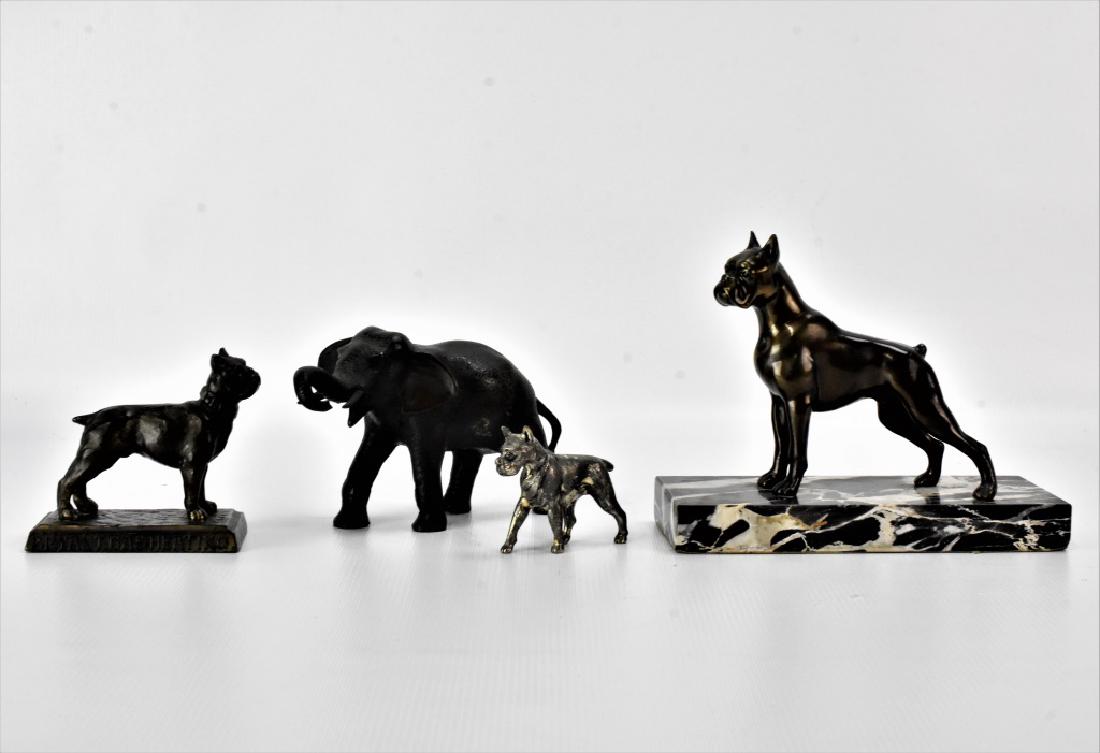 Bryant Gas Heating advertisement grouping: Bronze Sculptural Grouping, One early bronze sculpture of a Boxer advertisement piece " Bryant Gas Heating" and One possibly cold painted elephant either in bronze or iron. Spelter sculpture of a Boxe