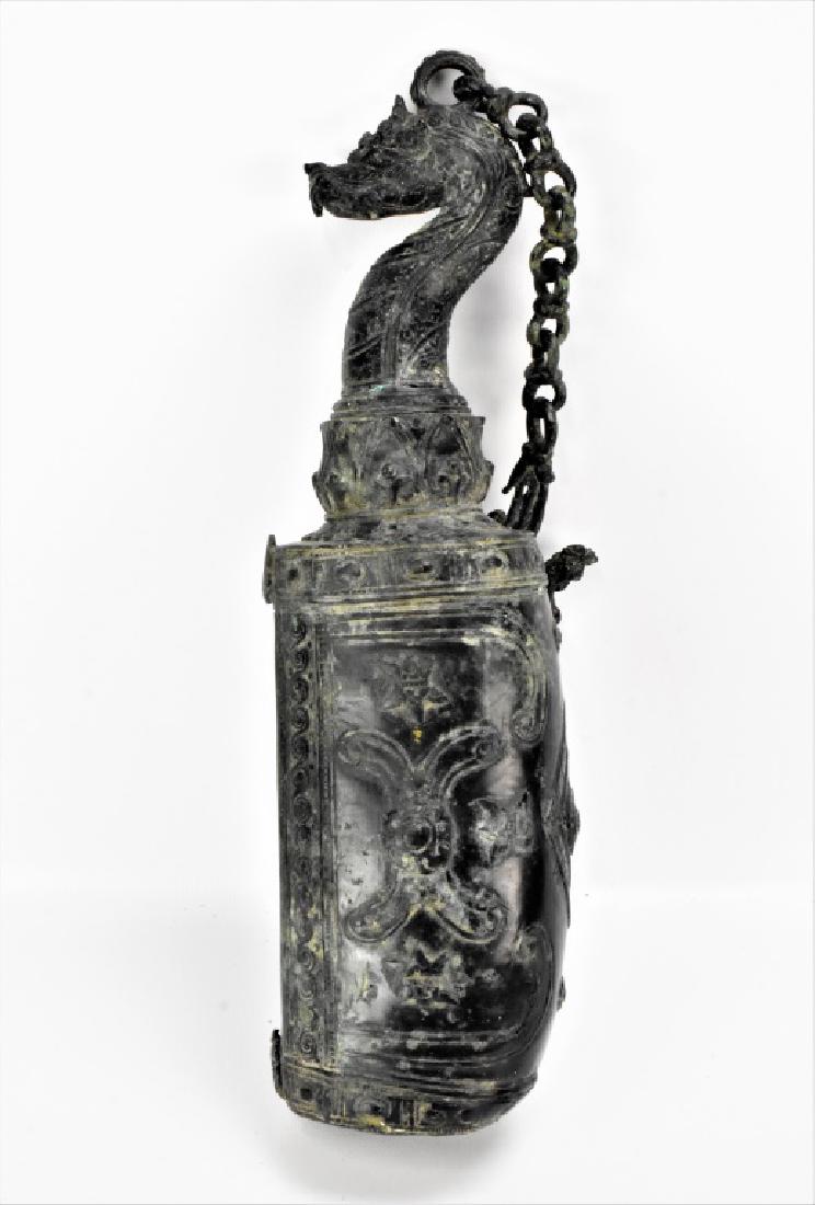 Bronze Tibetan or Buddhist Temple Bell: A large bell ornately decorated with dragon and other classical decorations. measuring approx. 18"h by 5"w. Bell is approx. 30"h including chain.