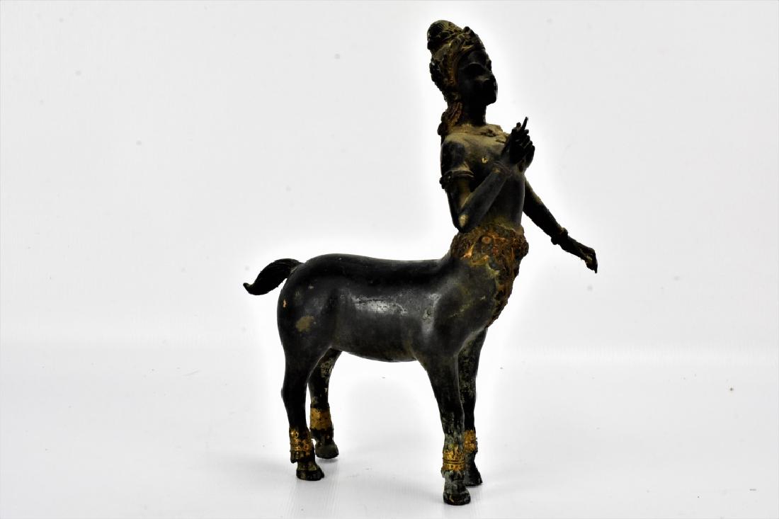 Bronze Hindu Kinnara: A fine bronze Hindu Kinnara. Shows appropriate ware. retains gold gilt decoration on lower chest, hoofs and legs, and headdress. Some signs of verdigris patina through out.