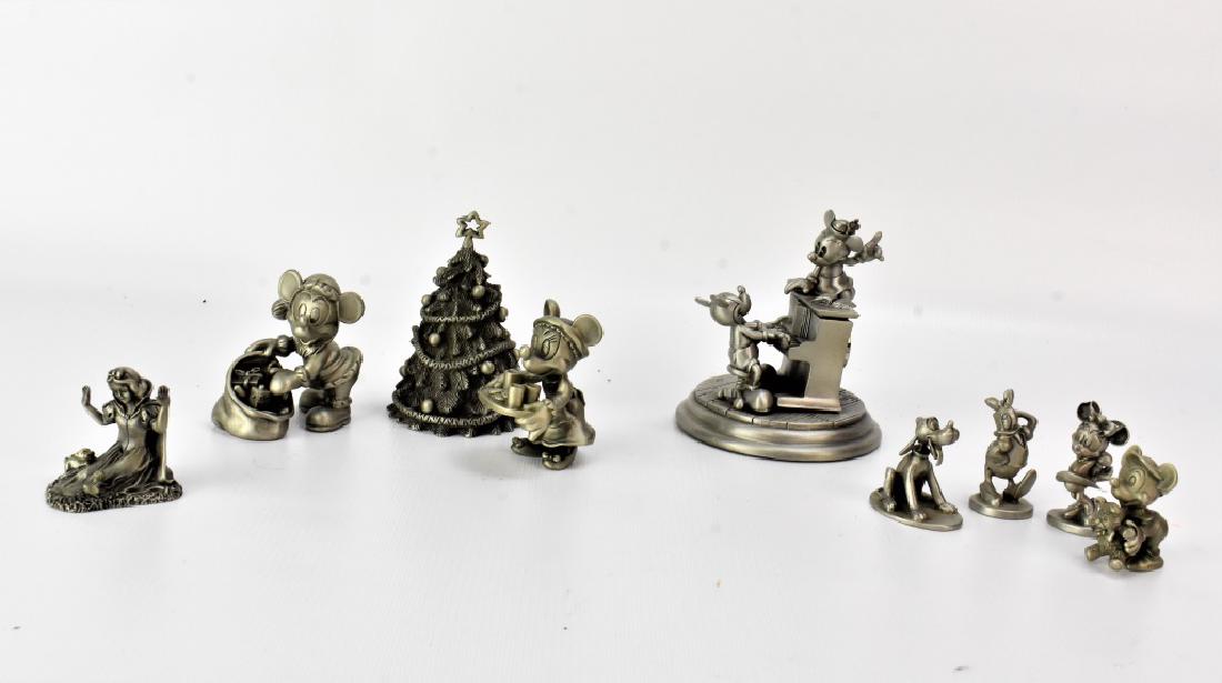 Disney Pewter Grouping: Grouping includes (9) pieces; a Linden Disney Mickey and Minnie Piano Quartz Clock #1061/5000, a pewter Minnie, Mickey, and Christmas tree, (4) small pewter pieces (Mickey, Minnie, Daisy, Pluto), and