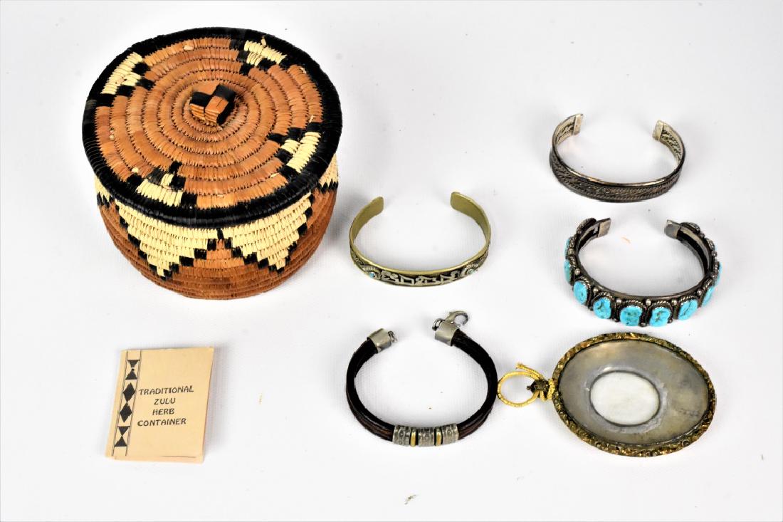 Native American Sterling Silver Jewelry Grouping: Native American Sterling Silver Jewelry Grouping (6) includes 4 bands, a locket, and an Iqutu Zulu Basket.