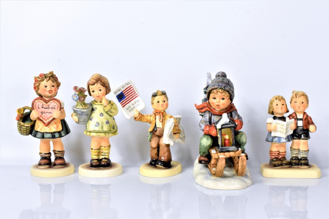 Hummel Goebel Grouping: Includes; Valentines Gift Hummel 387, Hummel 790 celebrating with sing "Zum 20. Geburtstag", Hummel 463 my wish is small, Hummel 2113 Extra! Extra, and Hummel 396 Ride into Christmas.