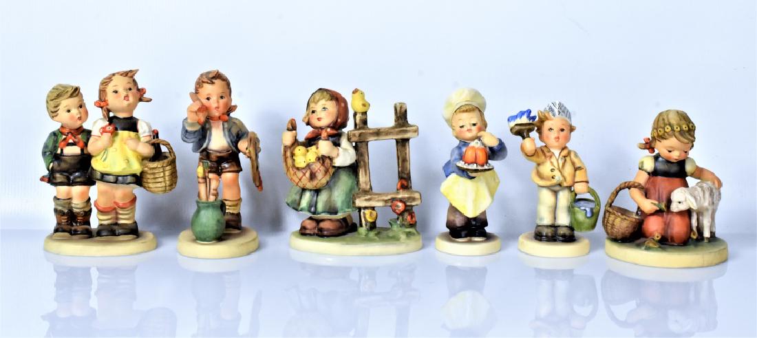Hummel & Goebel Figurines Grouping: Includes; Hummel 304 The Artist, Hummel 361 Favorite Pet, Hummel 2040 One Coat or Two, Hummel 385 Chicken Licken, Hummel 128 Baker, and Hummel 49 To Market