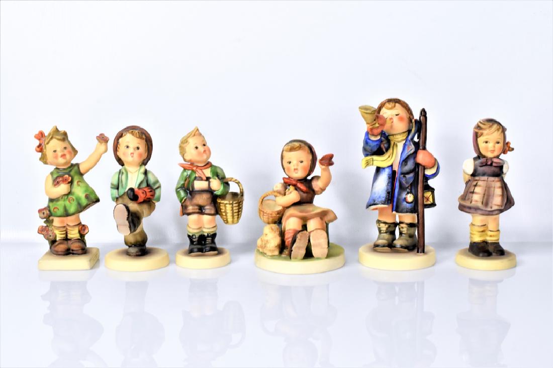Hummel & Goebel Figurines Grouping: Includes; Hummel 258 Witch Hand, Hummel 79 Globe Trotter, Hummel 72 Spring Cheer, Hummel 15 Hear Ye, Hear Ye, Hummel 65 Farewell, Hummel 51 Village Boy
