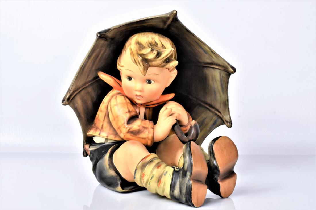 Goebel Hummel Umbrella Boy Large: A Goebel Hummel "Umbrella Boy" #152 A (incised on bottom of base) large figurine, measuring approx. 8"h. Goebel trade mark from 1960-1972