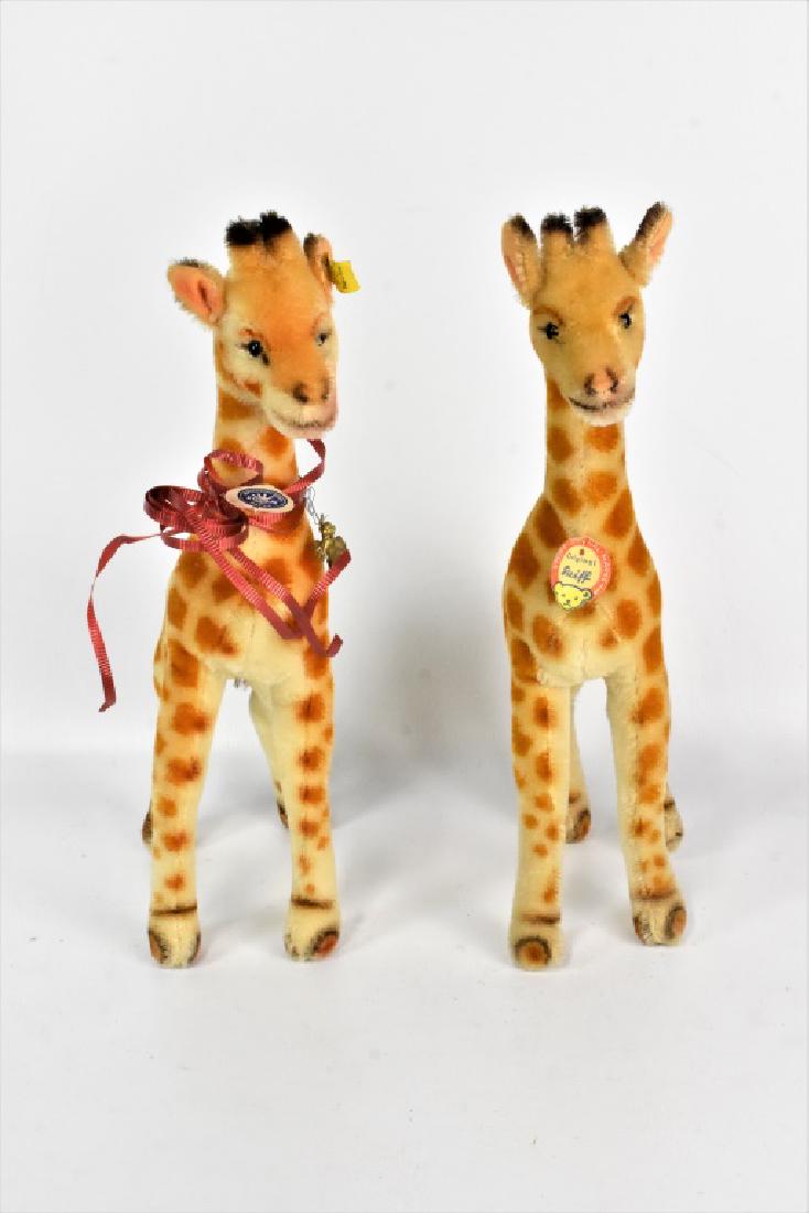 Original Steiff Mohair Giraffe Grouping: Grouping includes (2) vintage Steiff Mohair Giraffes with chest tags. One has ear button and attached tag, other has ear button. Measures approx. 14.25"h