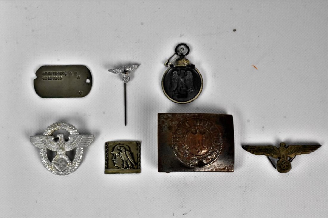 WW2 Nazi Memorabilia Grouping: WW2 Nazi Memorabilia Grouping includes Early WWII German Police Cap Insignia With Brass Pins, Nazi Party leader hat badge, German Eastern Frint Medal, Misc. Nazi Pin, and belt buckle