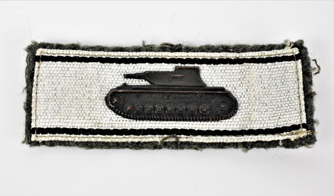 WWII Tank Destroyer Badge in Silver: A WWII Nazi Tank Destroyer Badge in Silver, awarded to soldiers for each tank they single handedly destroyed. Also includes a WWII Panzer Division Shoulder Board. Both are in fine condition, stiching 