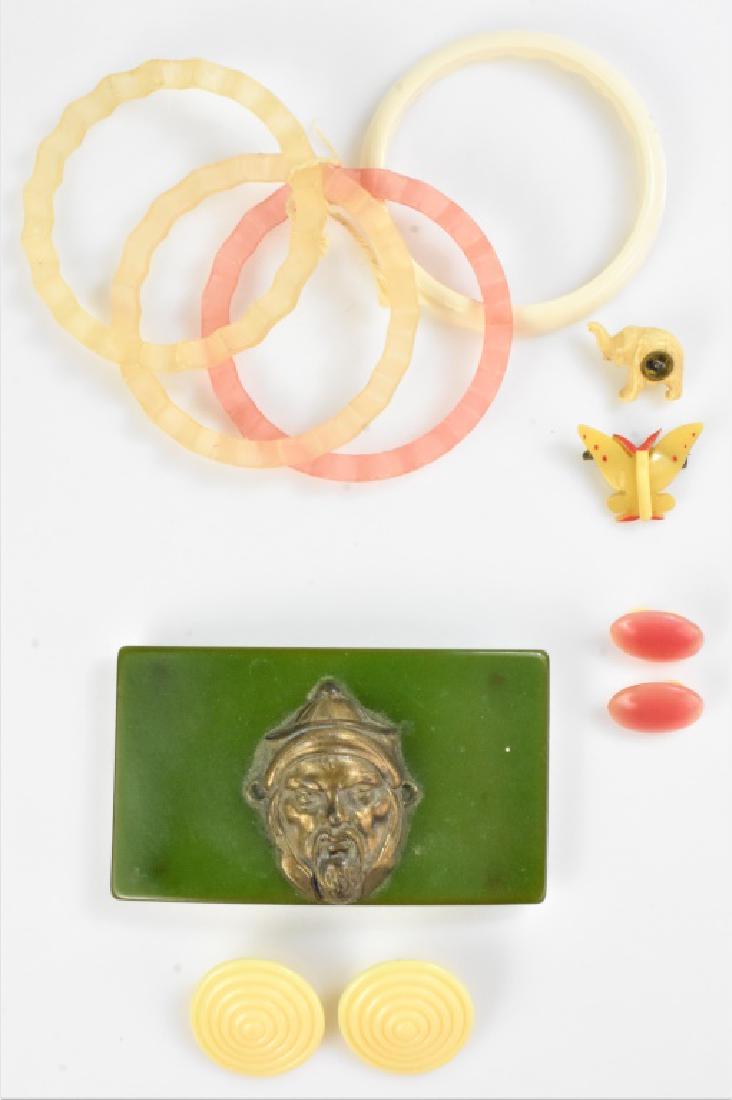 Bakelite Jewelry Grouping: Grouping includes (9) pieces, including (4) bracelets, (2) pairs of earrings, (2) brooches, (1) of which is bone, and (1) bakelite and brass belt buckle