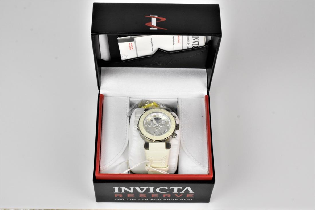 Invicta Reserve Ocean Reef Men's Watch: Invicta Reserve Ocean Reef Men's Watch model 10928 Swiss components with a white genuine calf leather band 46mm case size 200m water resistance. Includes case and instruction manual. Provenance: priva