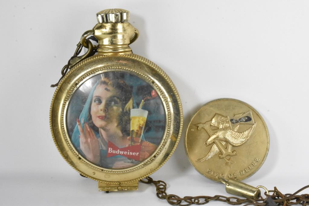 Anheuser Busch Clock: Crown is loose, but present. Bubble window has a crack. Cool piece, lights up and appears to work measuring appx: 12.25" x 17.75"